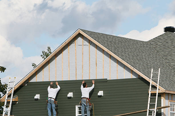 Professional Siding technician working in North Canton, OH